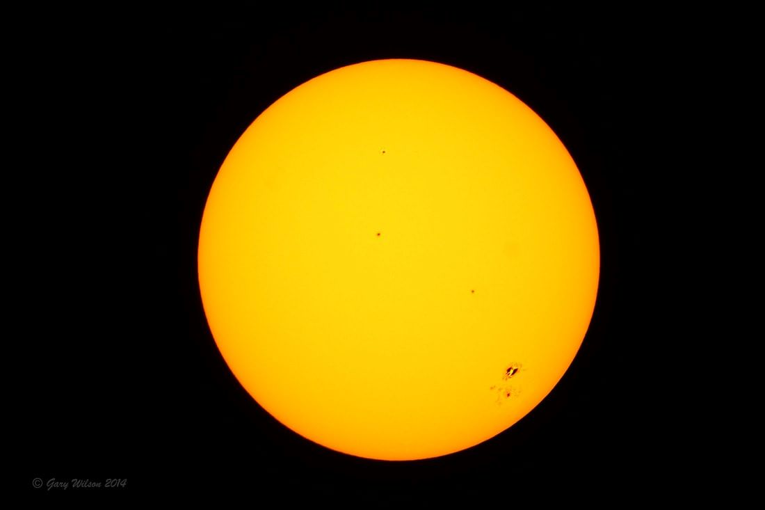 Sunspots on the Sun’s surface photographed through a Seymour Solar ND5 white-light solar filter tested to ISO 12312-2 transmission limits for safe solar viewing.